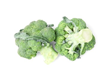 Photo of Fresh raw green broccoli isolated on white, top view