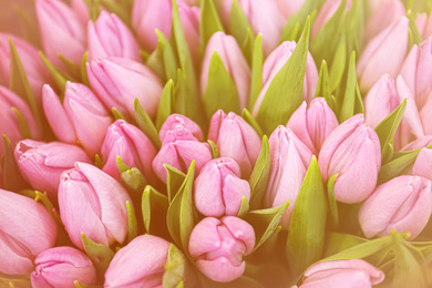 Image of Beautiful bouquet of violet tulip flowers as background, closeup