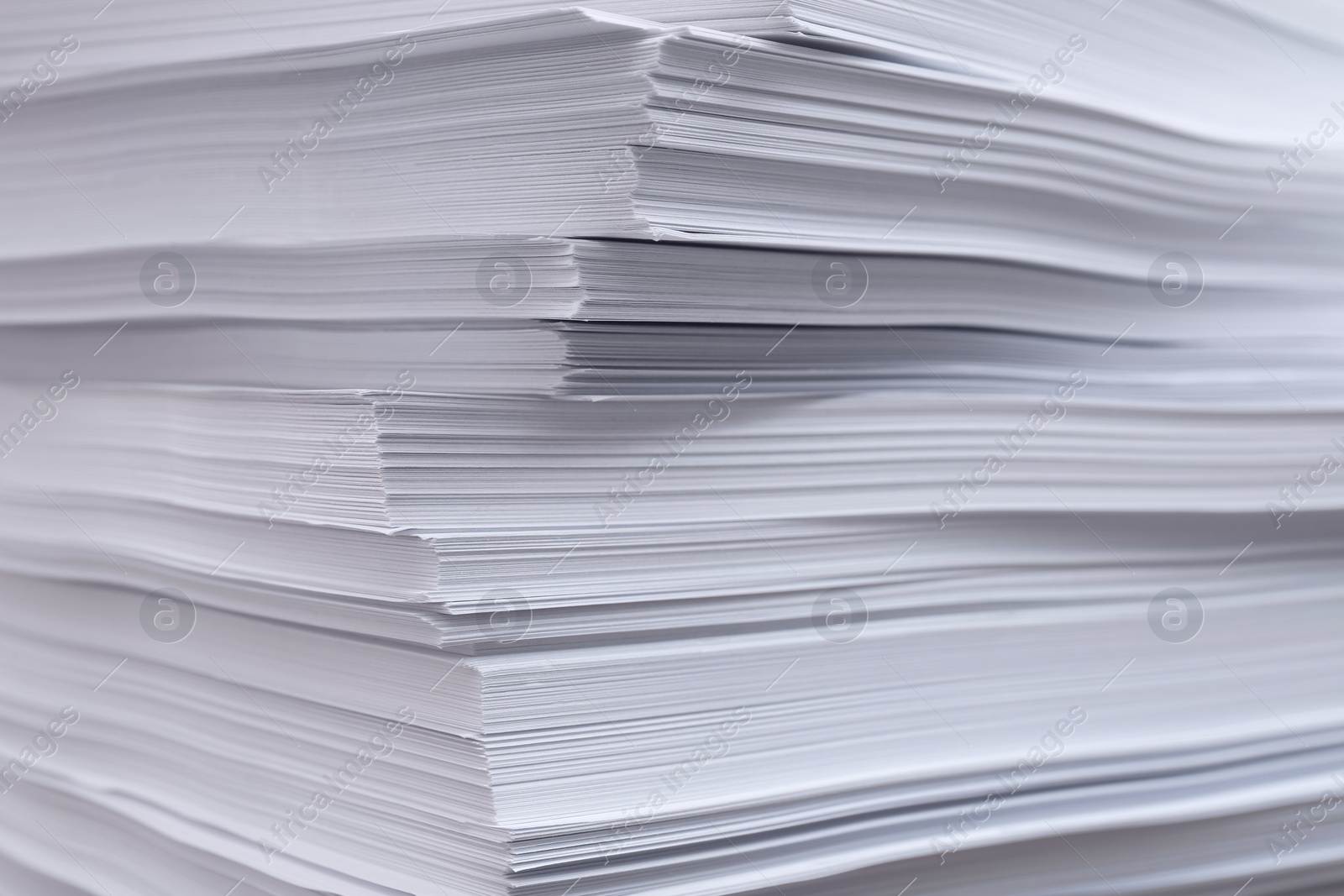 Photo of Stack of paper sheets as background, closeup