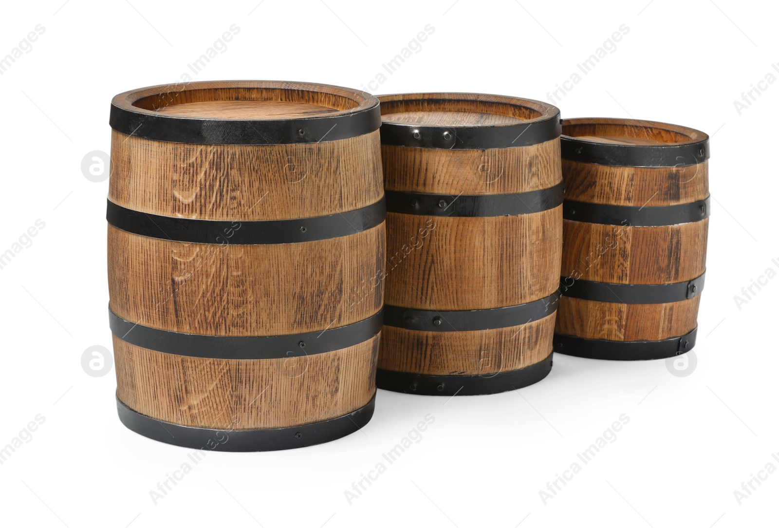 Photo of Three traditional wooden barrels on white background