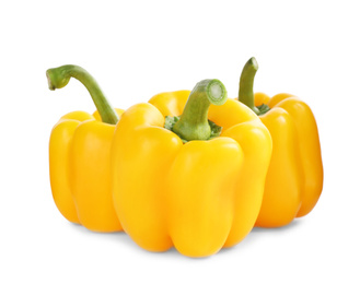 Photo of Ripe yellow bell peppers isolated on white