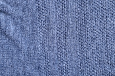 Photo of Texture of soft blue fabric as background, top view