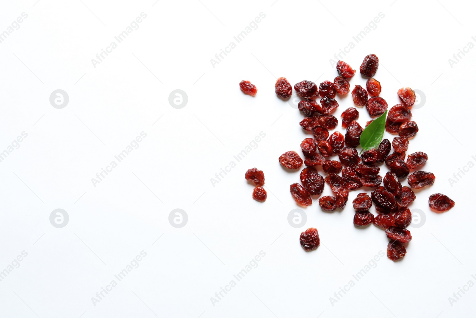 Photo of Cranberries on white background, top view with space for text. Dried fruit as healthy snack