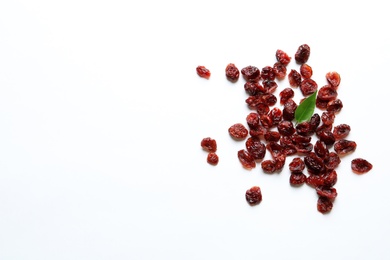 Cranberries on white background, top view with space for text. Dried fruit as healthy snack