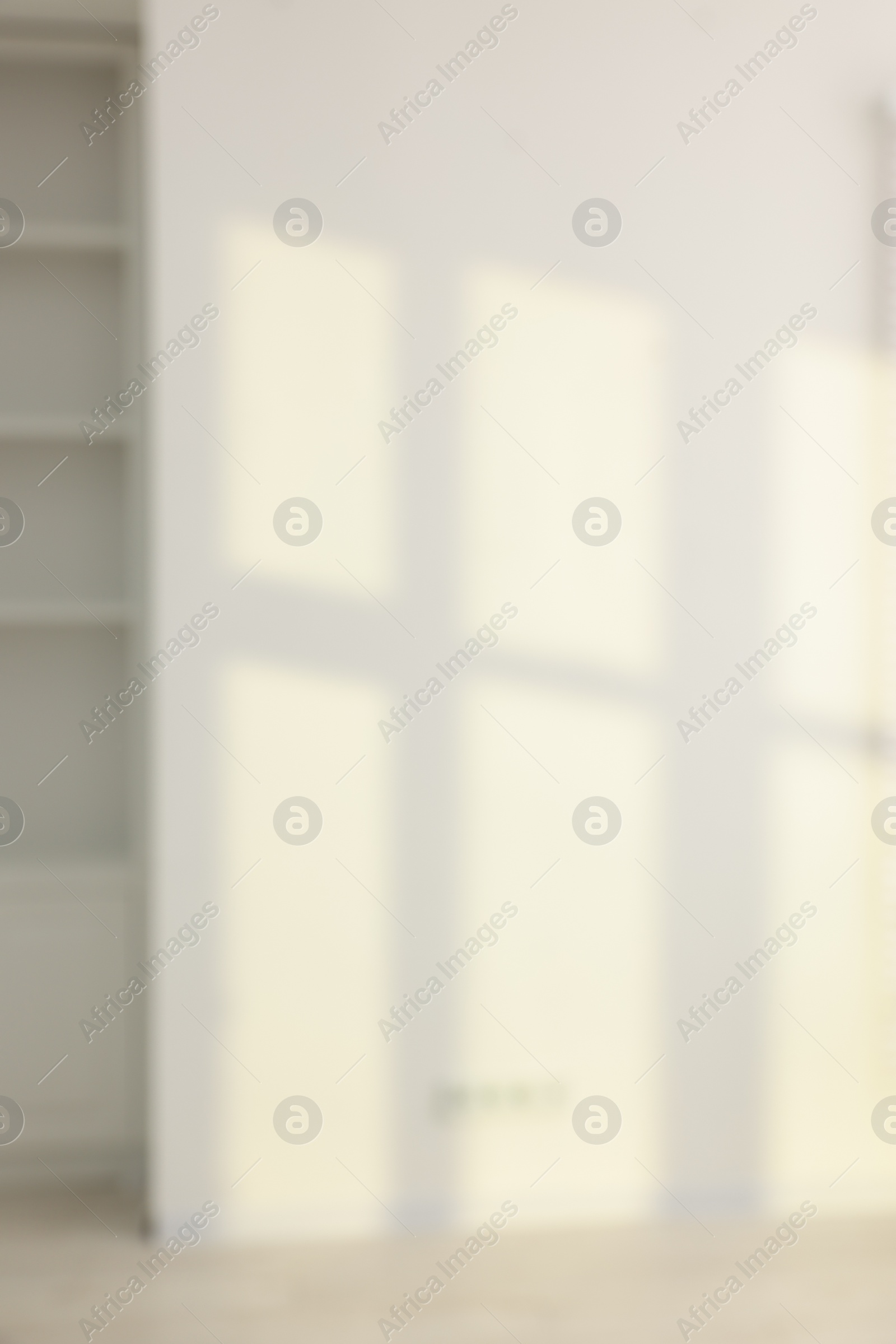 Photo of Blurred view of room with shadows on wall