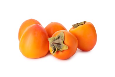 Photo of Delicious ripe juicy persimmons on white background
