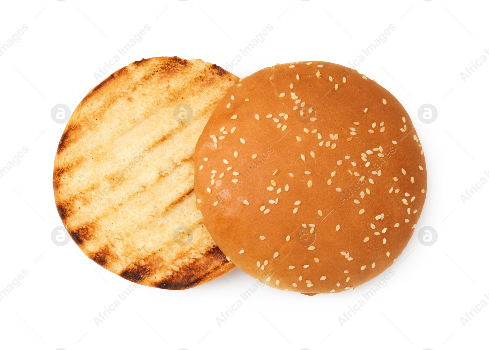 Photo of Halves of grilled burger bun isolated on white, top view