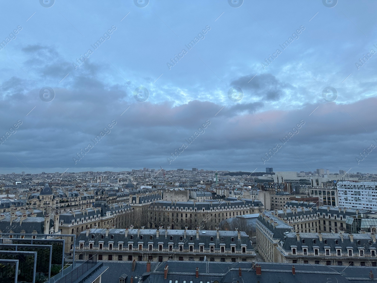 Photo of Beautiful buildings in Paris on cloudy day, view from hotel window