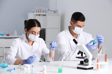 Photo of Scientists working with samples in chemical laboratory 