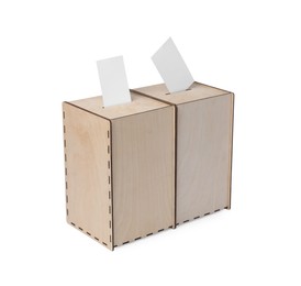 Photo of Wooden ballot boxes with votes isolated on white