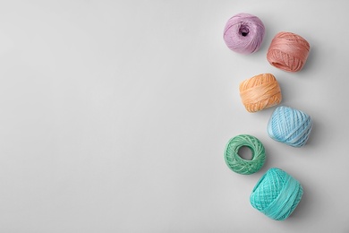 Photo of Color sewing threads on white background