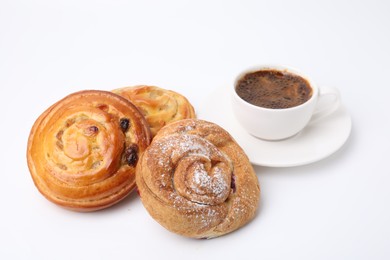 Delicious rolls with jam, powdered sugar, raisins and cup of coffee isolated on white. Sweet buns