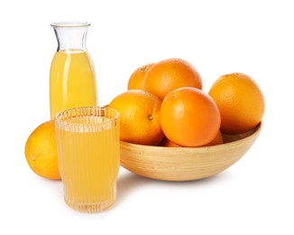 Fresh oranges in bowl and juice isolated on white