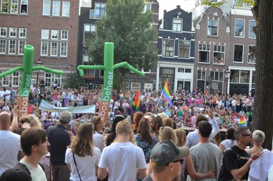 AMSTERDAM, NETHERLANDS - AUGUST 06, 2022: Many people at LGBT pride parade on summer day