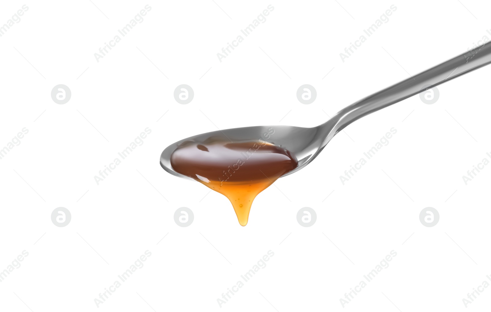 Photo of Salted caramel in spoon isolated on white