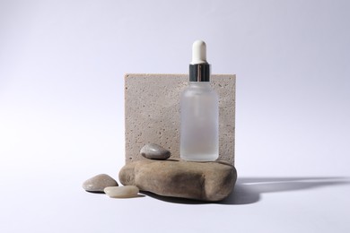 Photo of Composition with bottle of cosmetic serum on white background