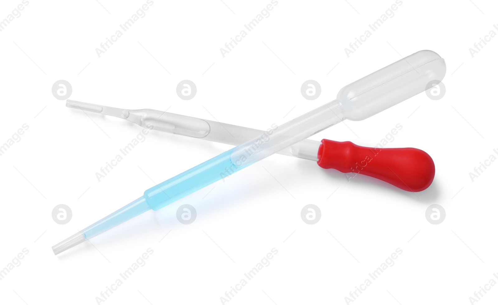 Photo of Two pipettes with liquid isolated on white, top view