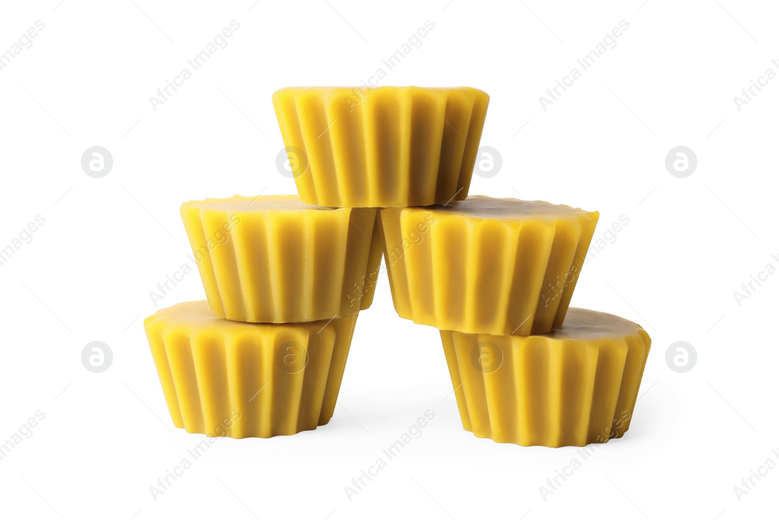 Photo of Natural beeswax cake blocks on white background