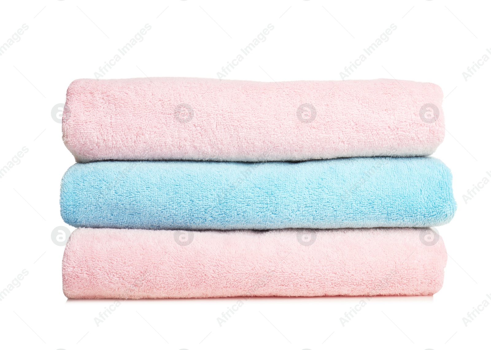 Photo of Folded soft terry towels on white background