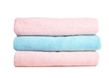 Photo of Folded soft terry towels on white background