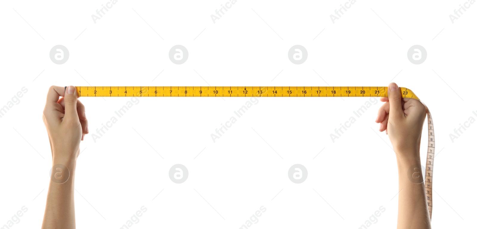 Photo of Woman holding yellow measuring tape on white background, closeup