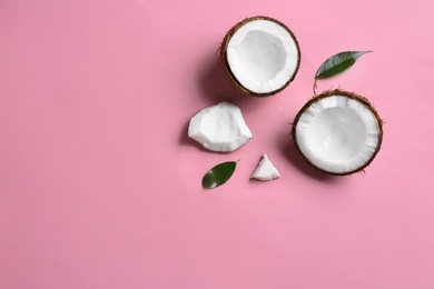 Photo of Flat lay composition with coconuts on color background. Space for text