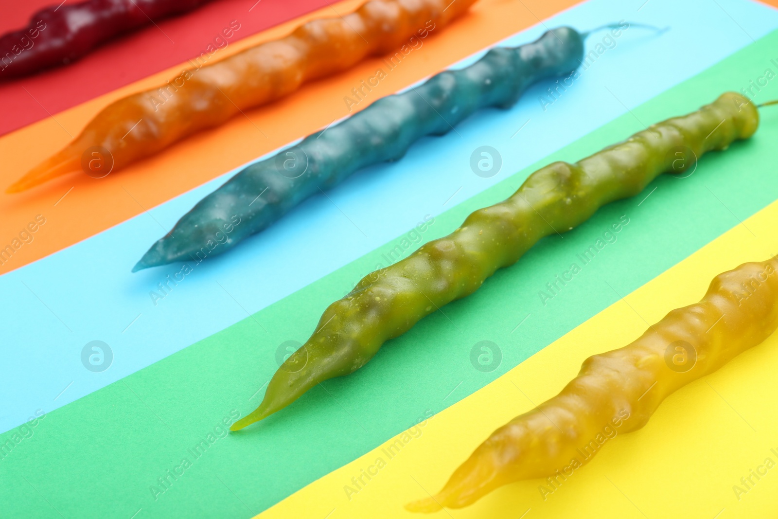 Photo of Many different delicious churchkhelas on color background, closeup