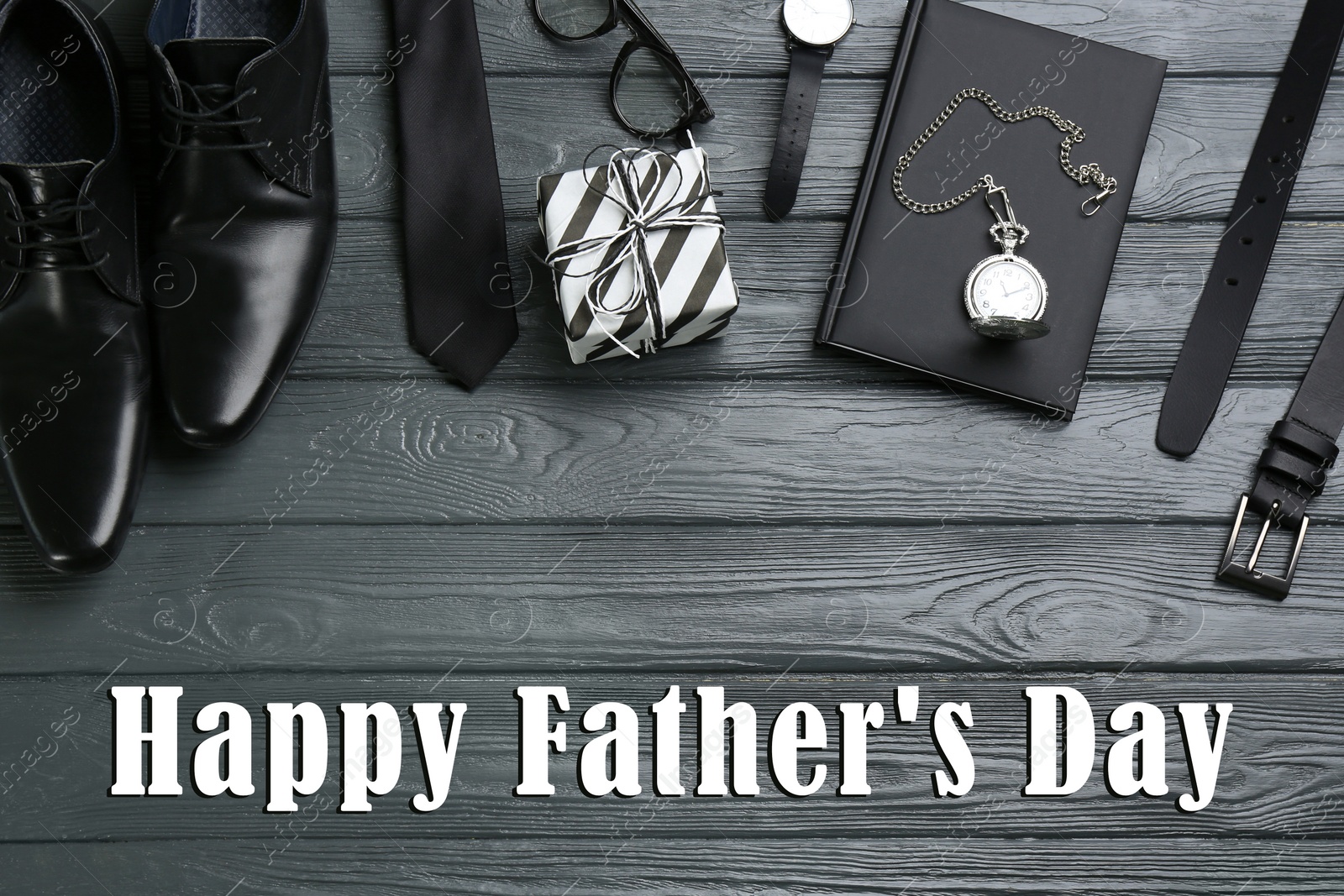 Image of Flat lay composition with male accessories and phrase HAPPY FATHER'S DAY on grey wooden background