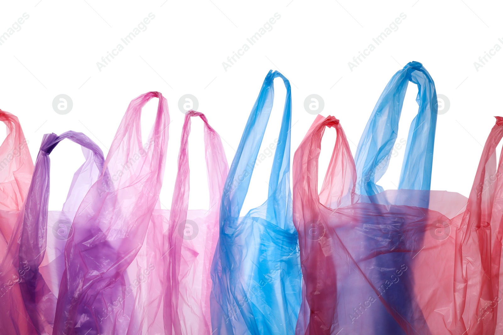 Photo of Many different plastic bags on white background