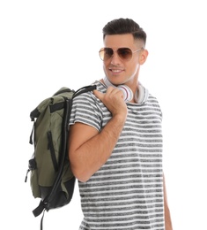 Man with backpack and headphones on white background. Summer travel