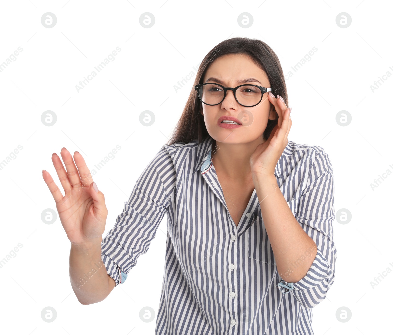 Photo of Young woman with vision problem wearing glasses on white background