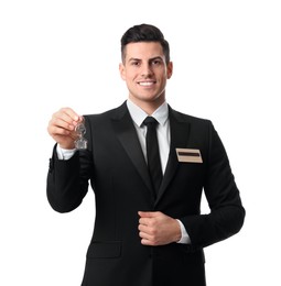 Photo of Happy receptionist in uniform holding key on white background