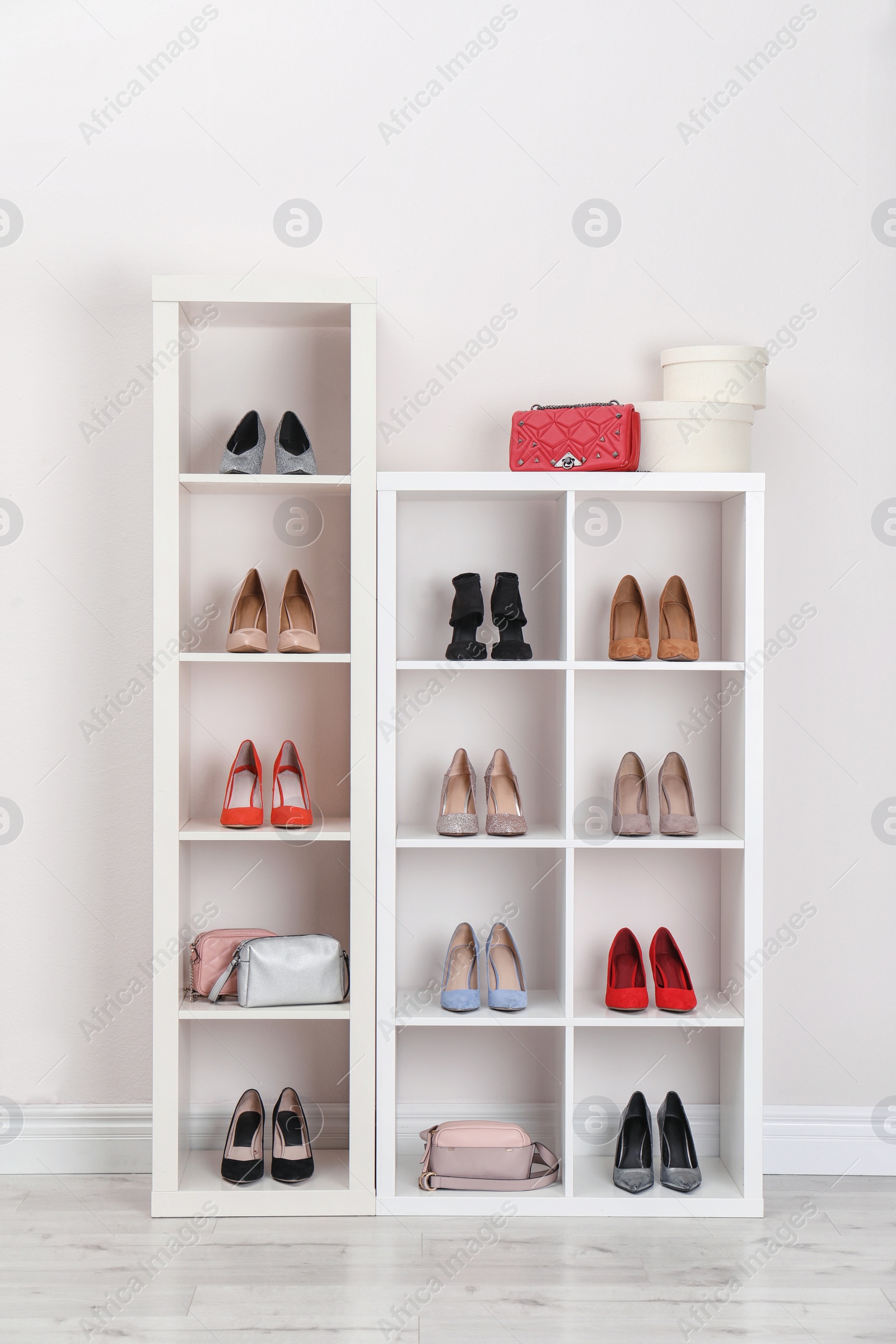 Photo of Wardrobe shelves with different stylish shoes indoors. Idea for interior design