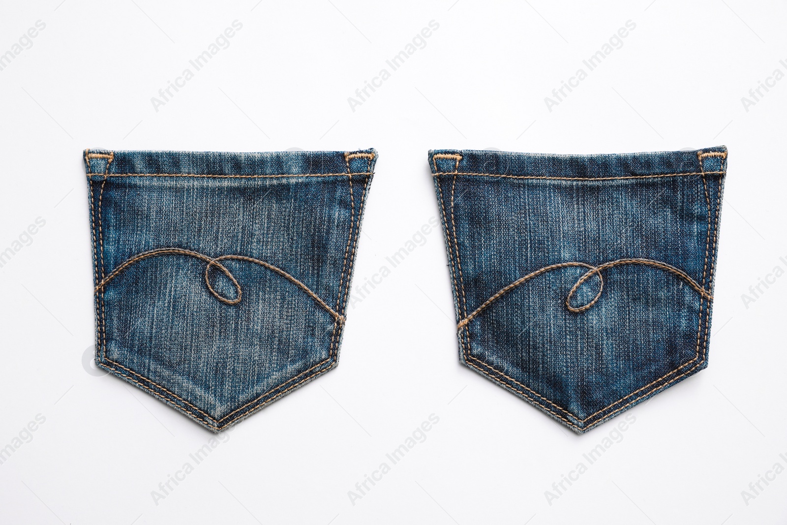 Photo of Jeans pockets isolated on white, top view