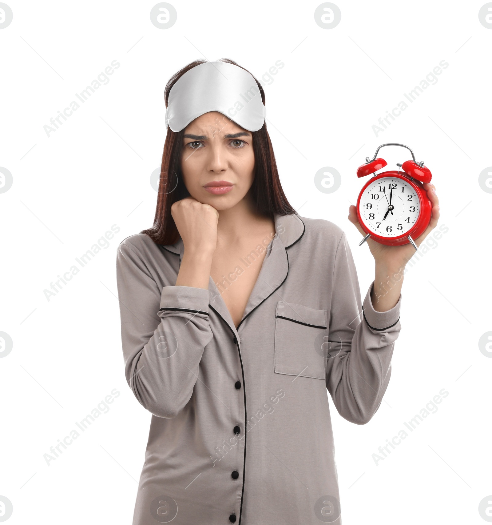 Photo of Emotional overslept woman with alarm clock on white background. Being late concept