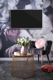 Image of Modern wide screen TV on wall in room with stylish furniture 