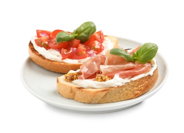 Plate with tasty bruschettas on white background