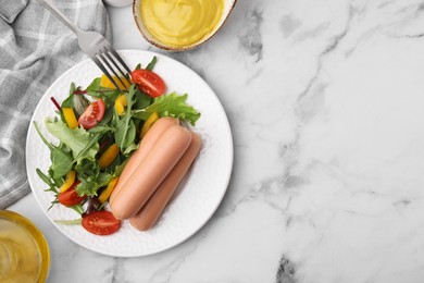 Delicious boiled sausages with salad served on white marble table, flat lay. Space for text