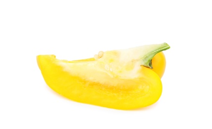 Cut yellow bell pepper with seeds isolated on white