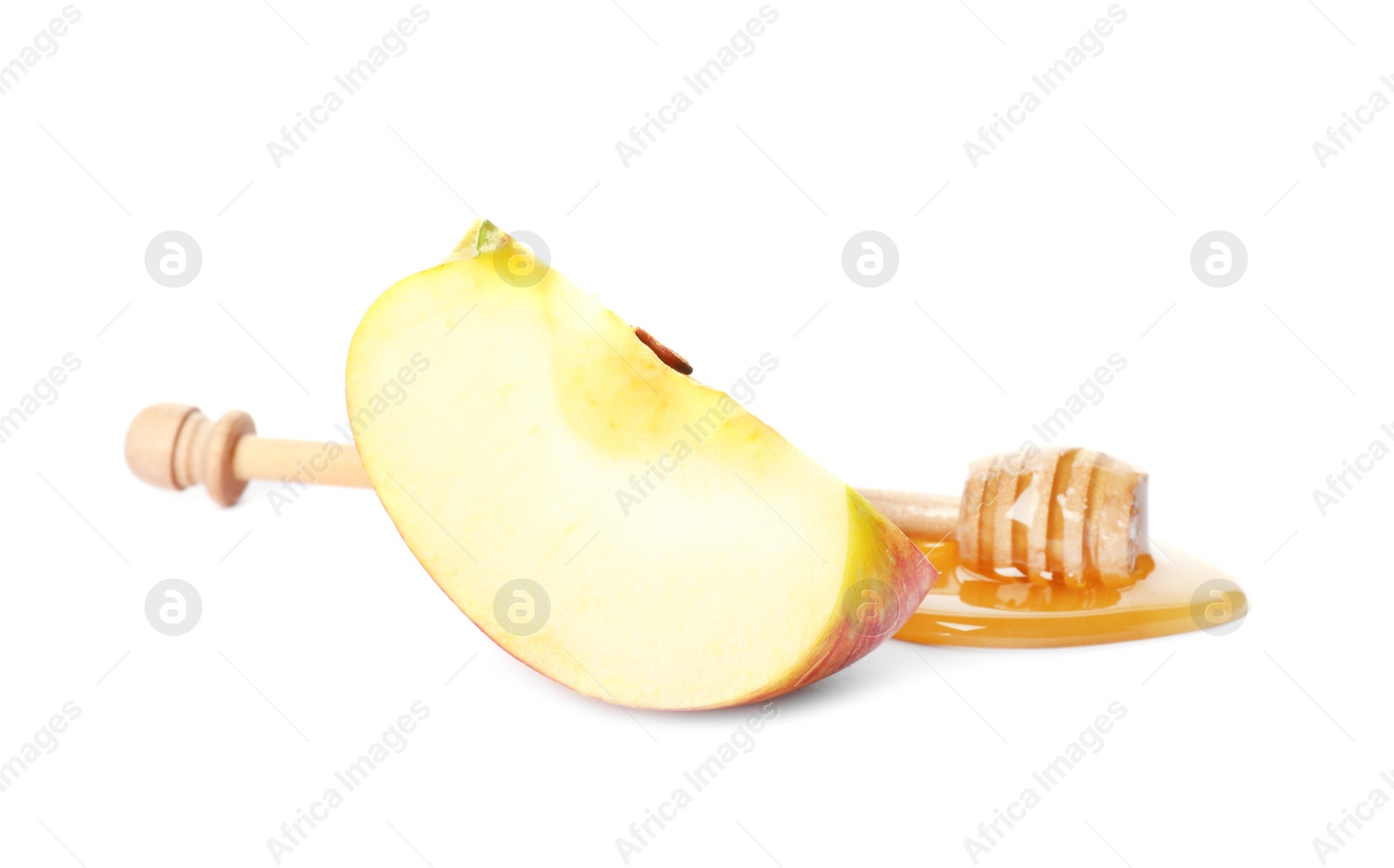 Photo of Dipper with sweet honey and sliced apple on white background