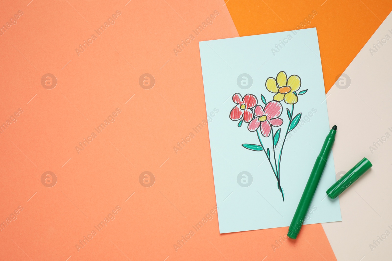 Photo of Handmade greeting card and felt tip pen on color background, top view with space for text. Happy Mother's Day