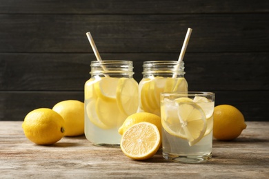 Natural lemonade in glassware on wooden table