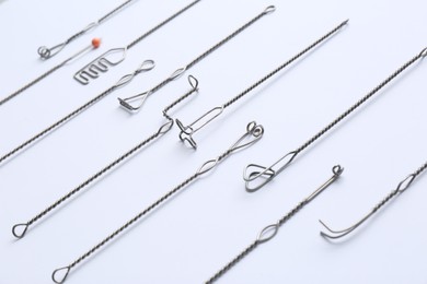 Photo of Set of logopedic probes on white background. Speech therapist's tools