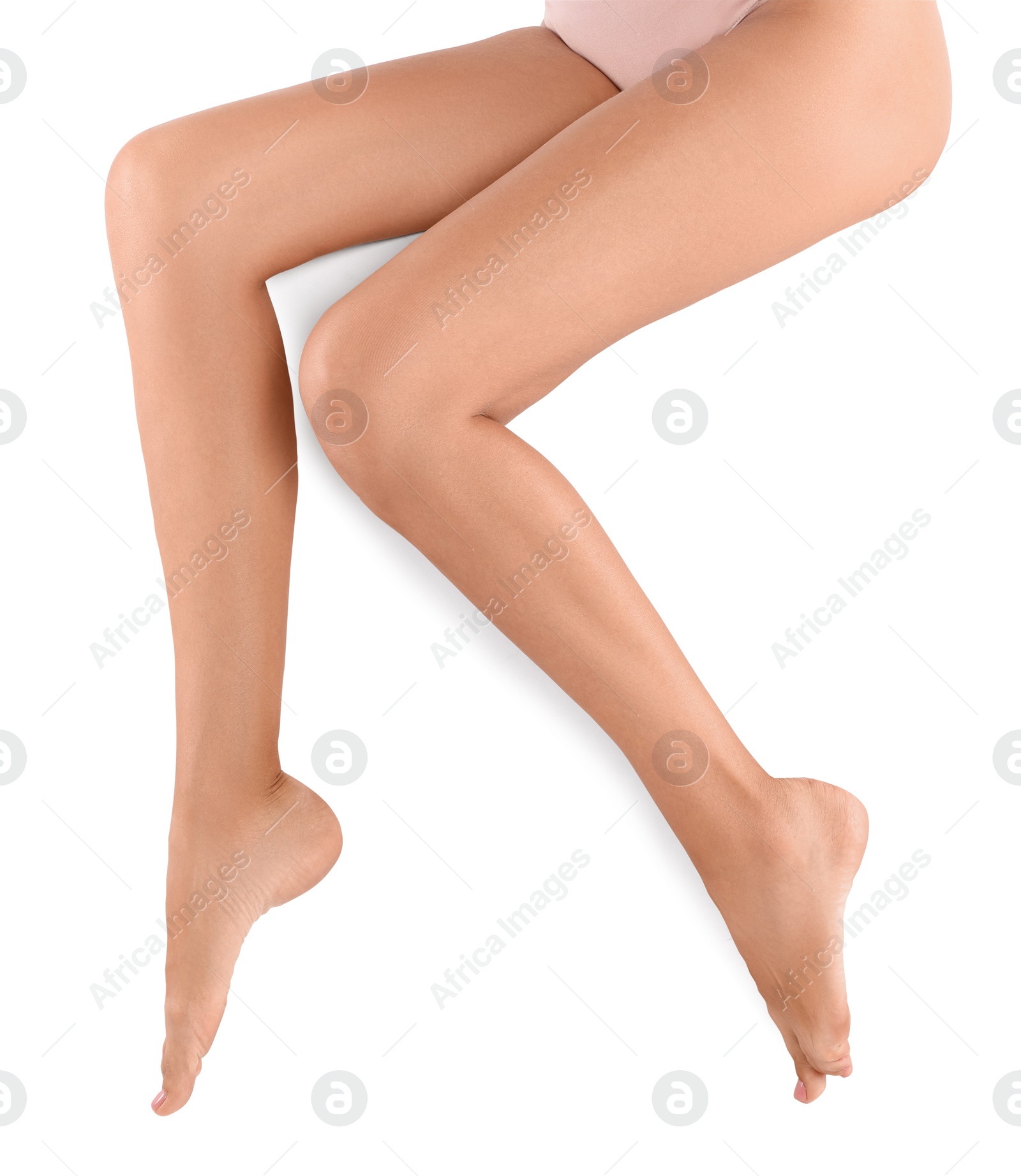 Photo of Woman with beautiful long legs on white background, closeup