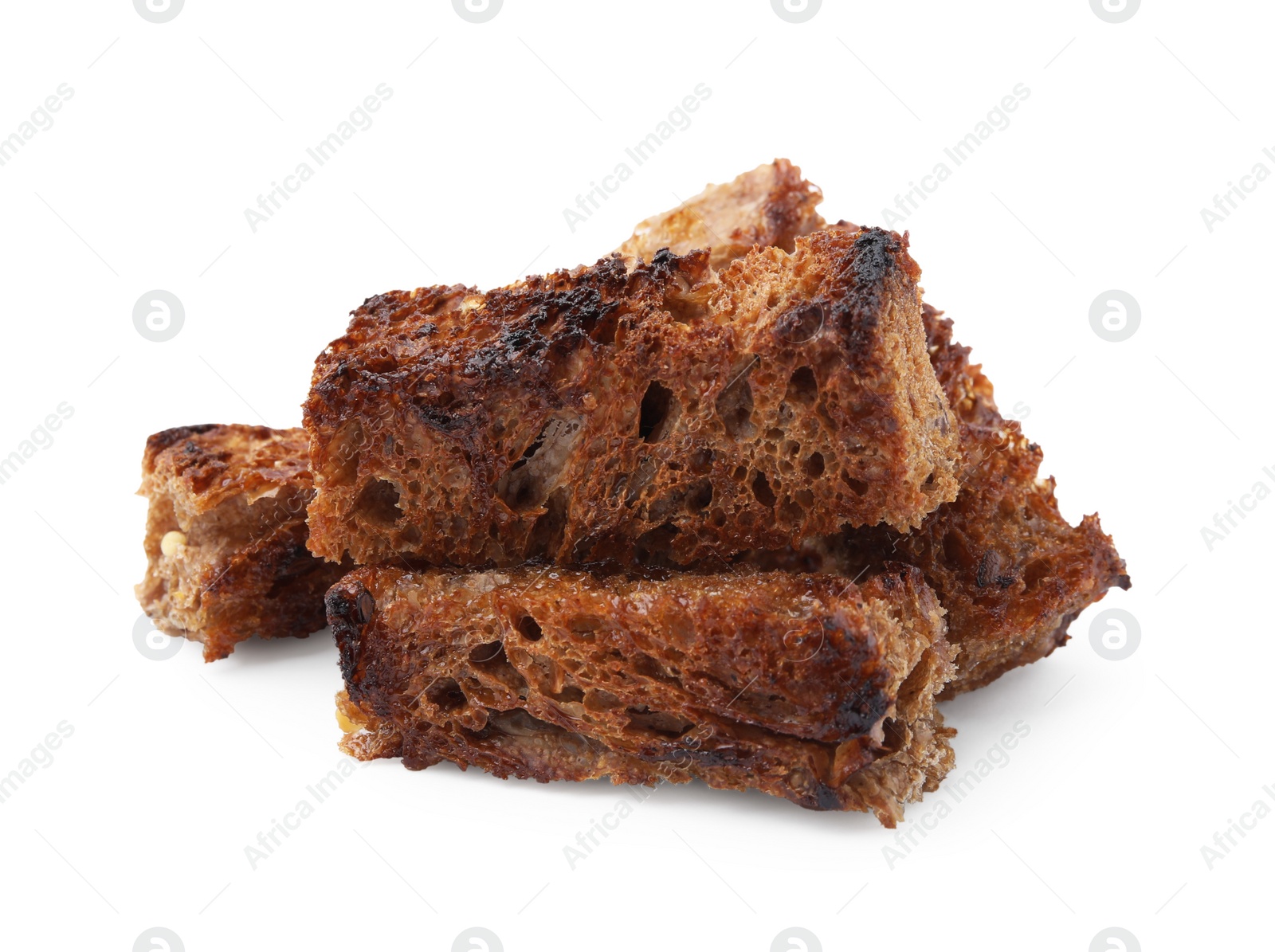 Photo of Heap of crispy rusks isolated on white