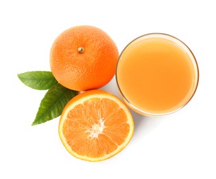 Photo of Orange juice, fresh fruits and green leaves on white background, top view