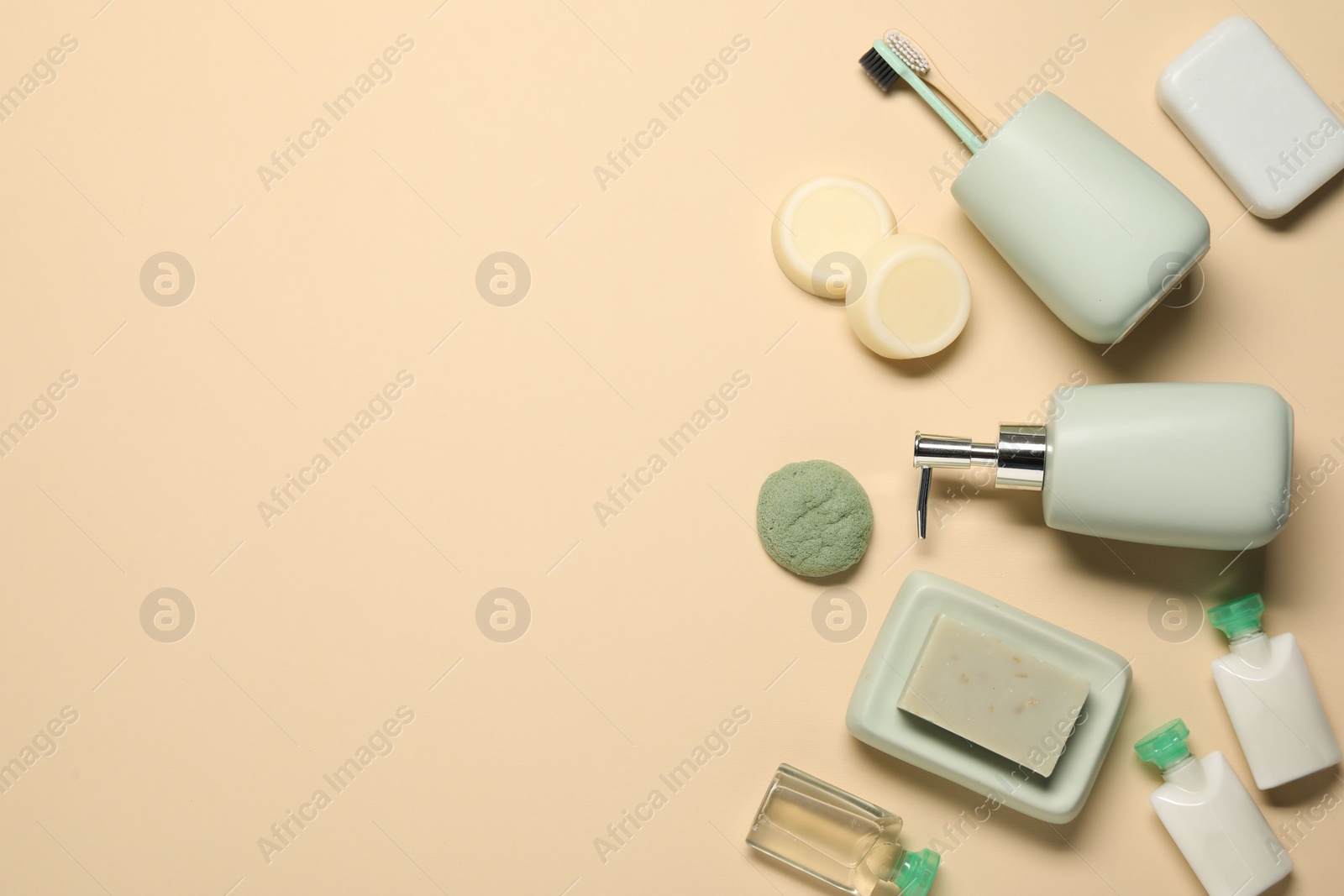 Photo of Bath accessories. Flat lay composition with personal care products on beige background, space for text