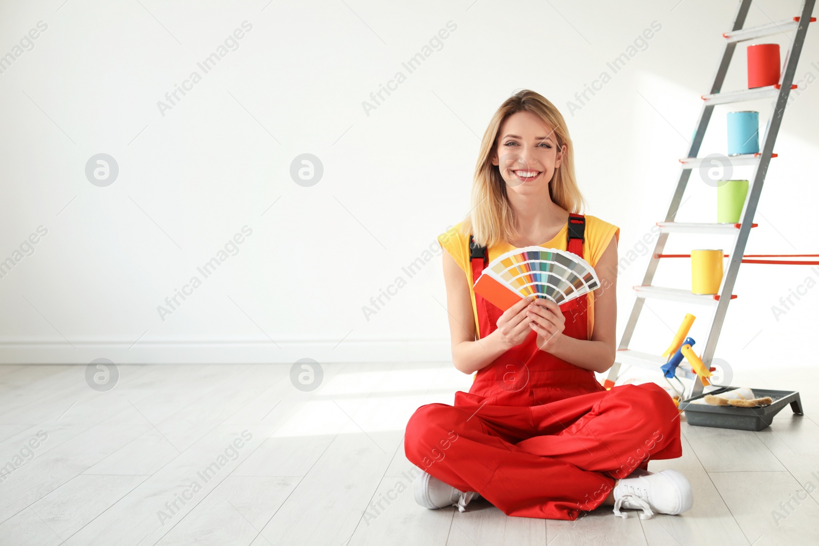 Photo of Female decorator with color palette indoors