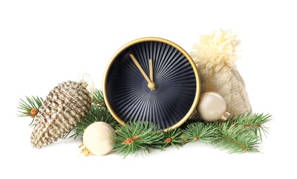 Photo of Alarm clock, hat and festive decor on white background. New Year countdown