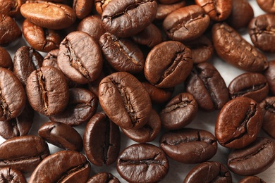 Photo of Roasted coffee beans as background, top view